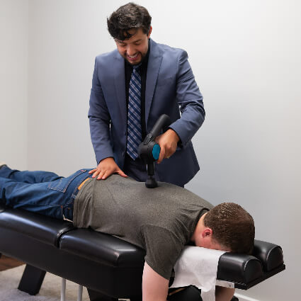 adjusting man's back