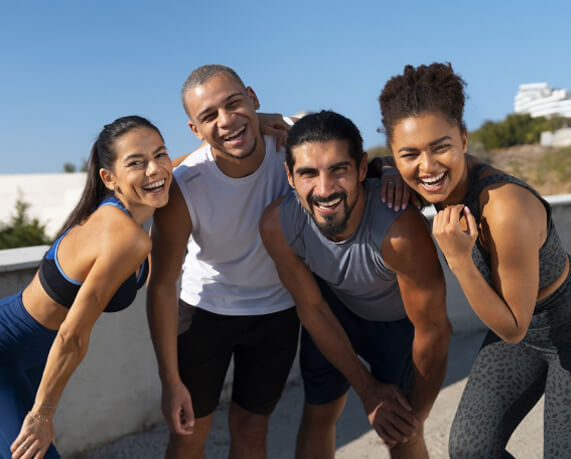Group of smiling sporty adults