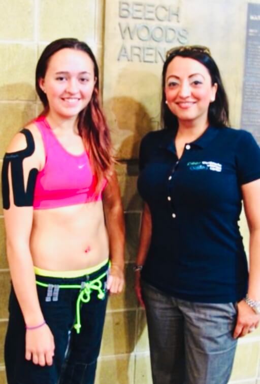 Chiropractor and athlete posing for a photo