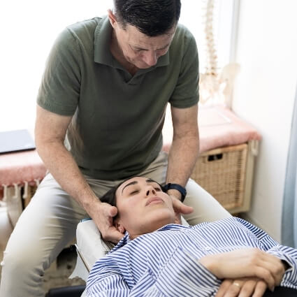 patient having neck adjusted