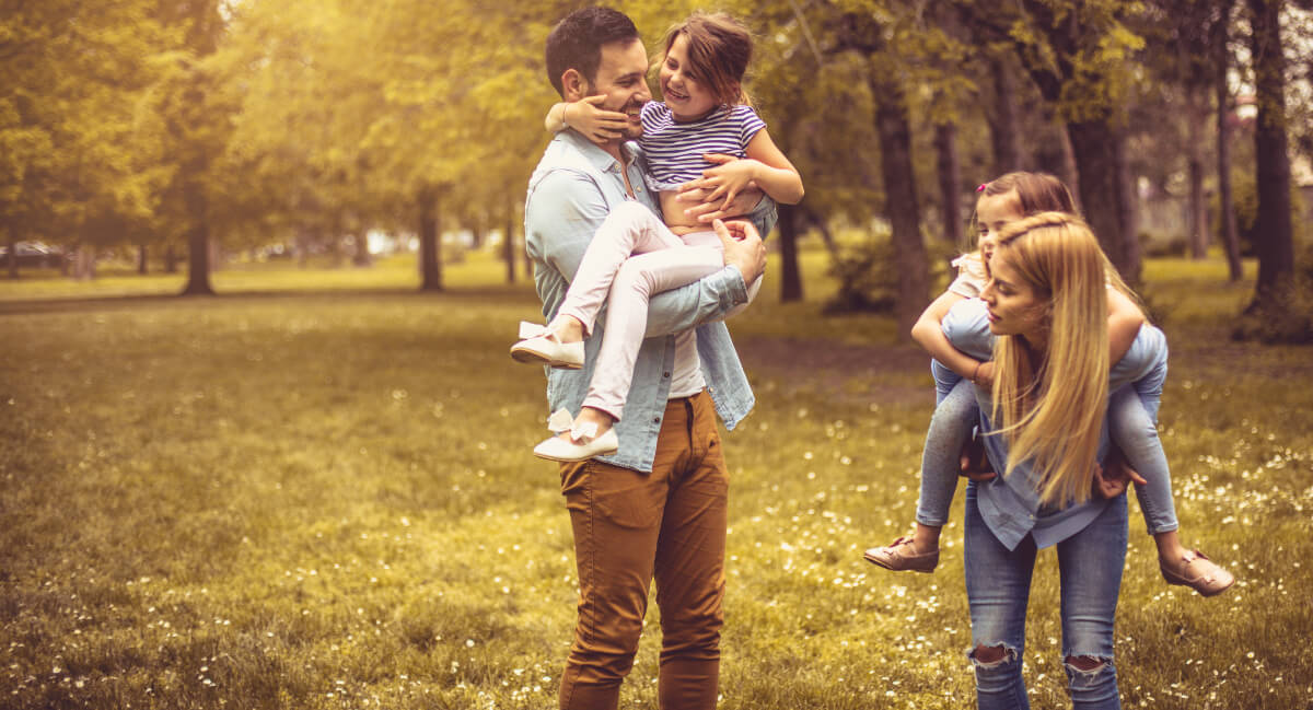Family of four out in nature