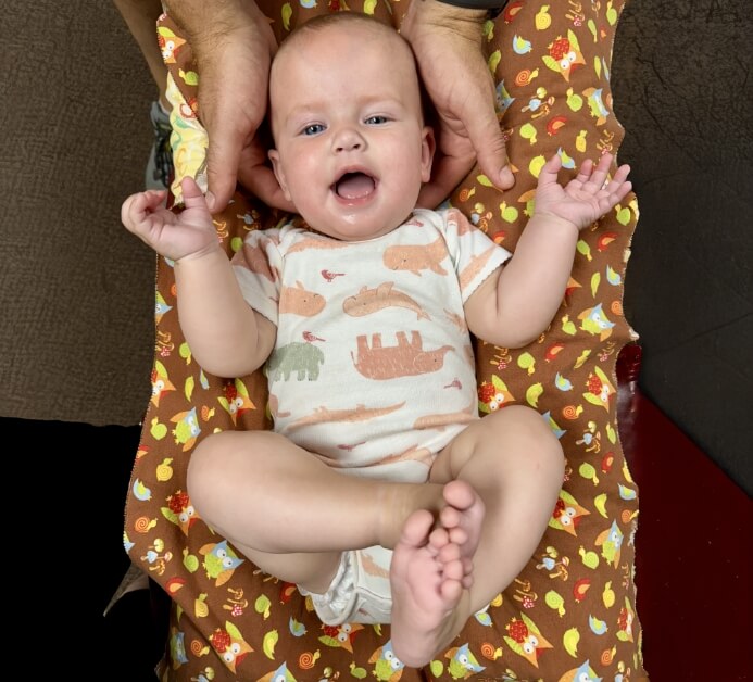 Crookston chiropractor adjusting patient's neck