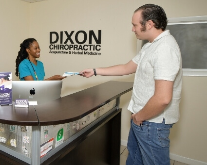 Oakland Park patient checking in at Dixon Chiropractic