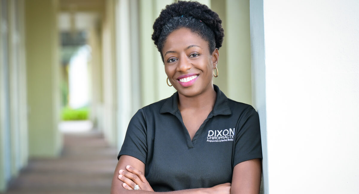 Dr. Dixon of Dixon Chiropractic with her arms folded