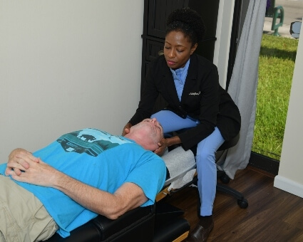 Oakland Park patient treated with a chiropractic neck adjustment