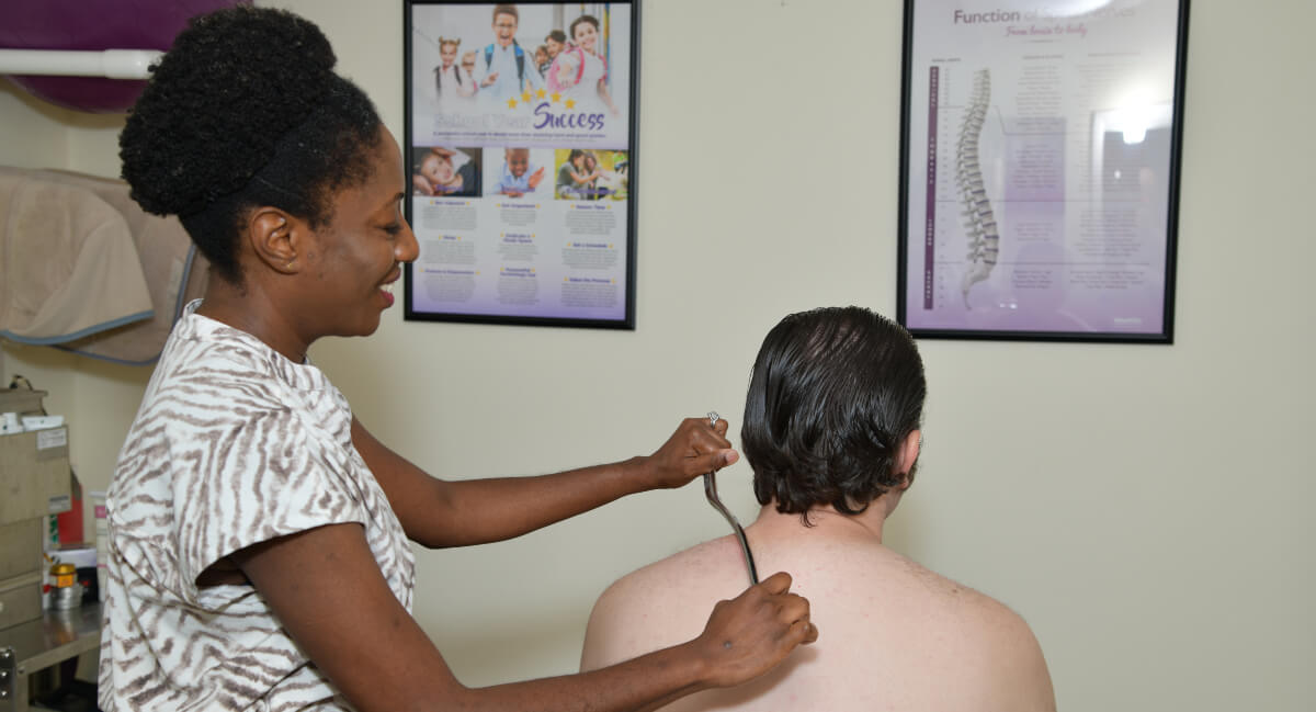 Oakland Park chiropractor using granston therapy on patient
