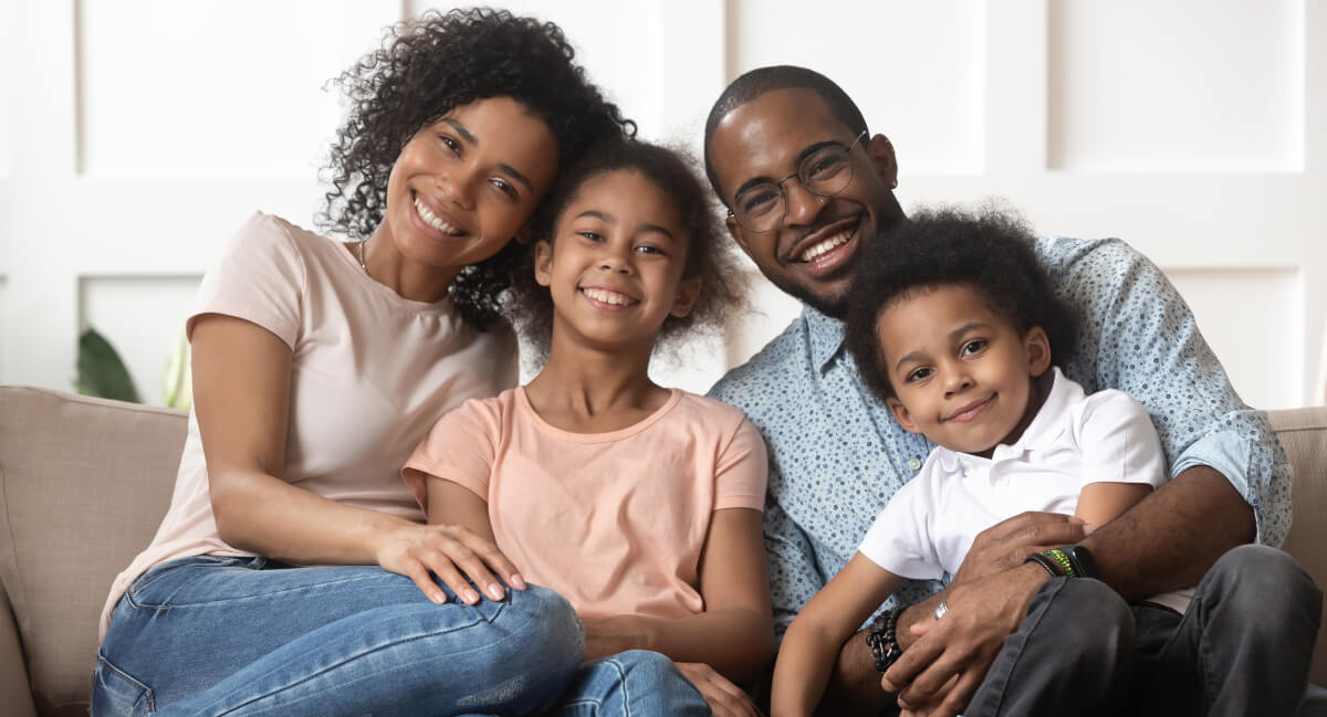Smiling family of four