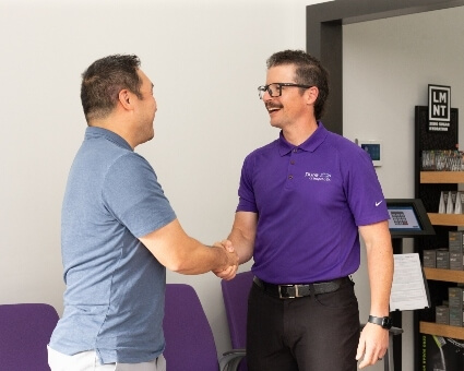 Vienna chiropractor greeting patient