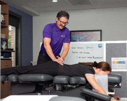 Lower-back adjustment used on female patient