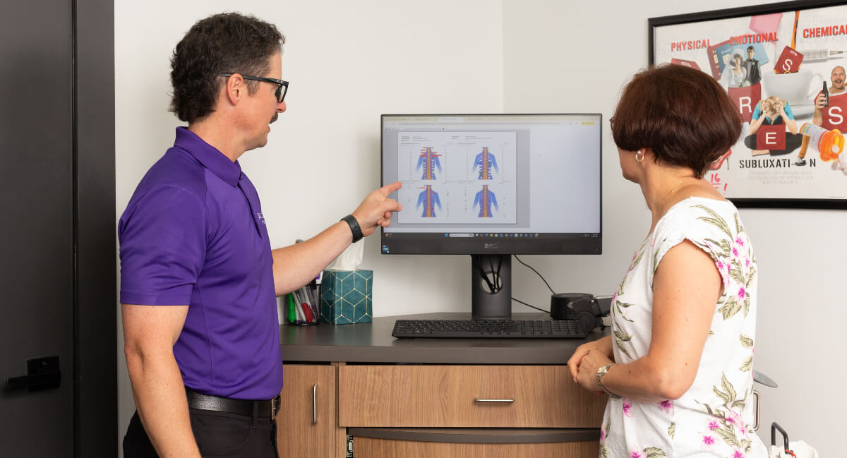 Vienna chiropractor discussing results with patient