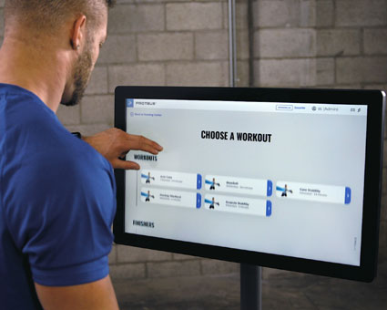 man picking workout on screen
