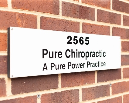 Signage on brick wall