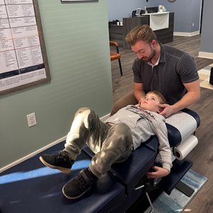 Eldersburg Chiropractor Dr. Noah adjusting boy
