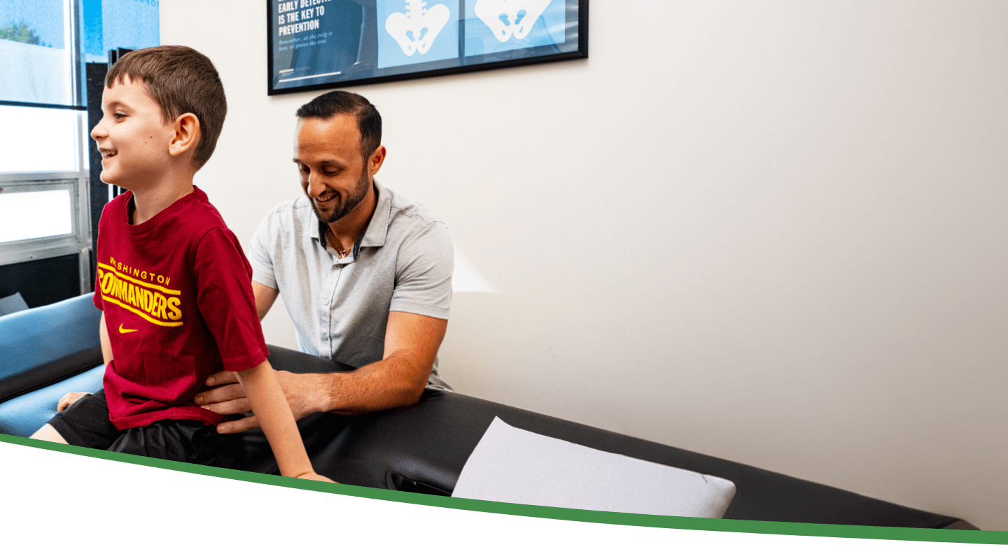 Wappingers Falls chiropractor Dr Vallon adjusting childs back