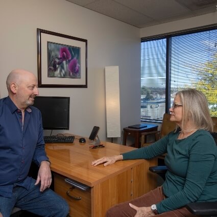 Dr Munn talking with a patient