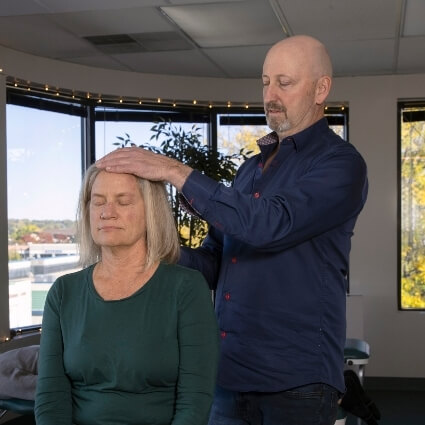 Dr Rick adjusting patients head