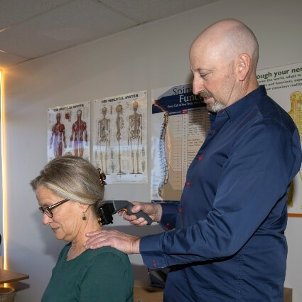 Dr Munn scanning patients neck