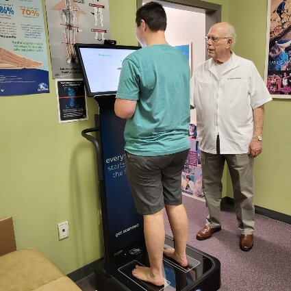 patient on our orthotics machine