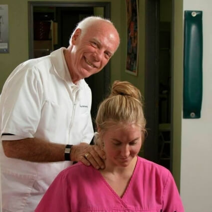 Baton Rouge chiropractor Dr Wolverton smiling with a patient