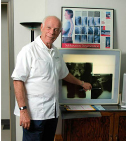 Photo of Dr. Harrie Wolverton with xrays.