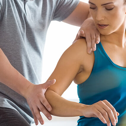 woman having arm examined