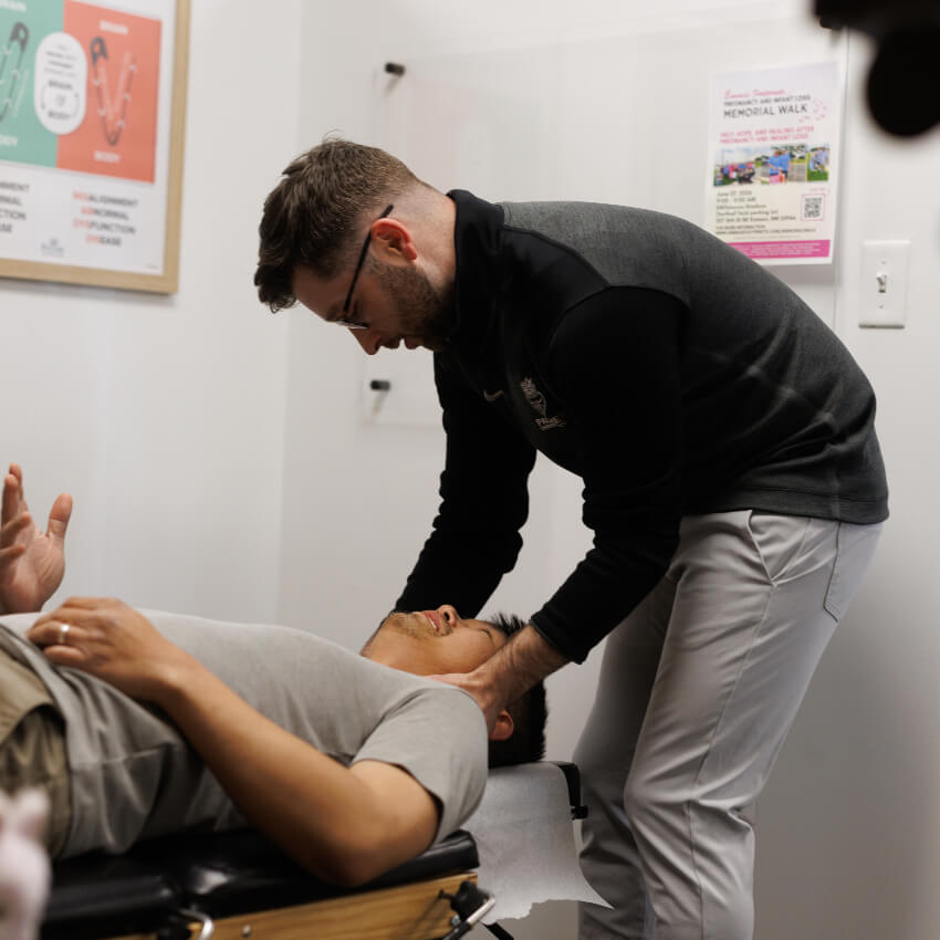 Dr Levi adjusting patients neck