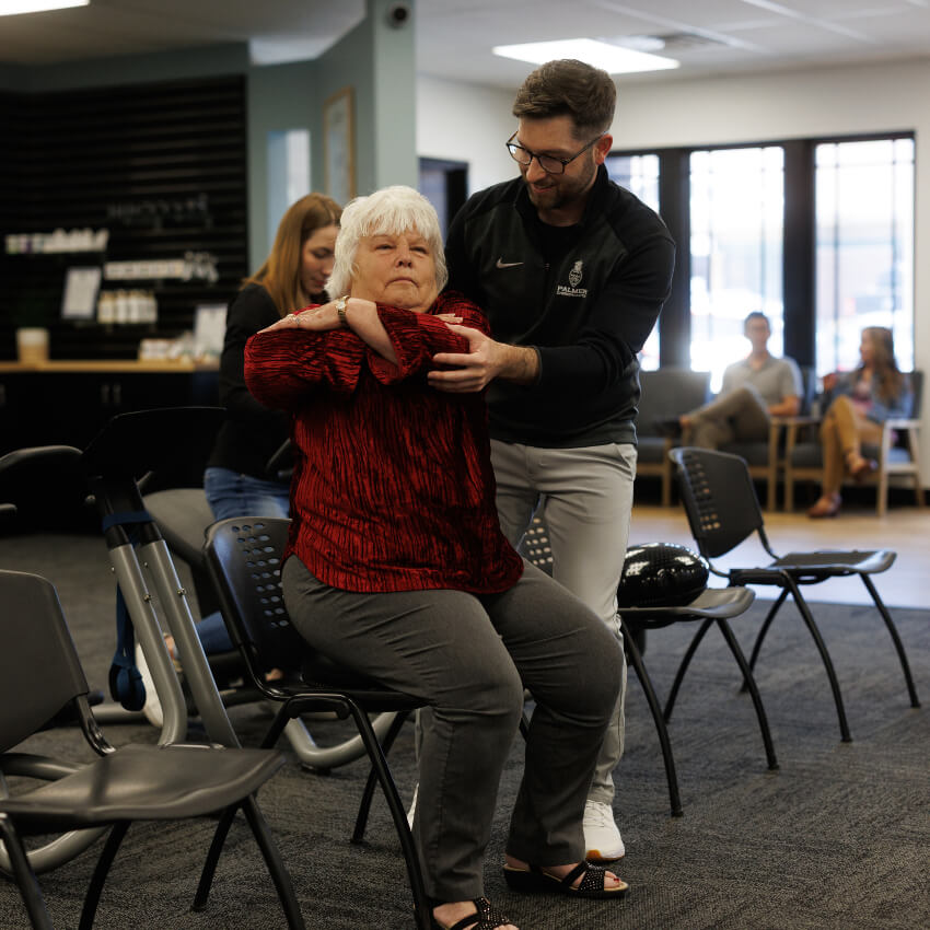 Dr Levi doing exercise with woman