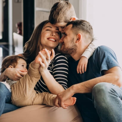 happy family photo with mom, dad, and 2 kids