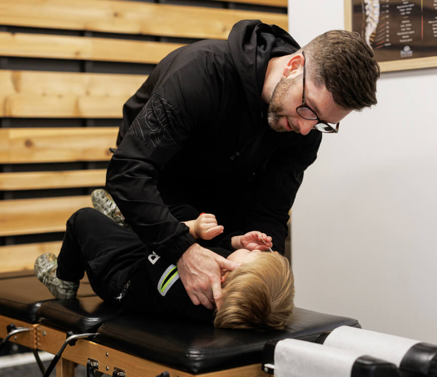 Rochester Chiropractor adjusting patient