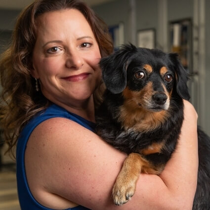 Dr Christina hugging the office dog