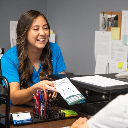 Doctor providing patient with booklet