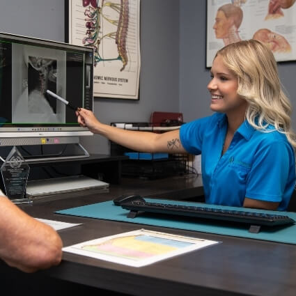 doctor showing patient xrays