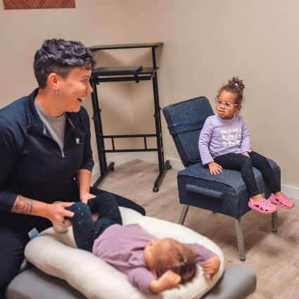 Dr Brandy smiling with child patients