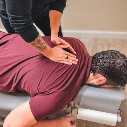 Dr Brandy adjusting patients back