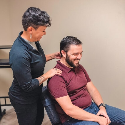 Dr Brandy touching patients shoulders