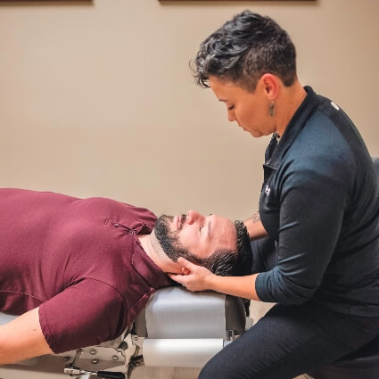 Dr Brandy adjusting patients neck