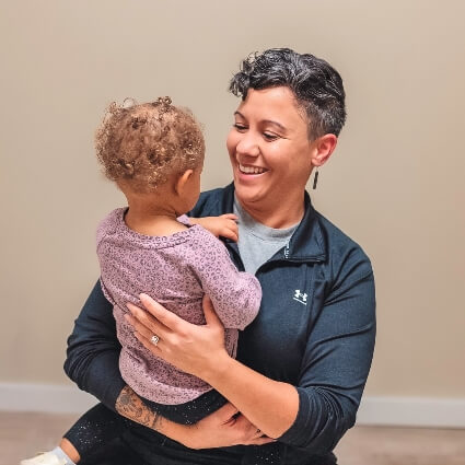 Dr Brandy playing with young patient