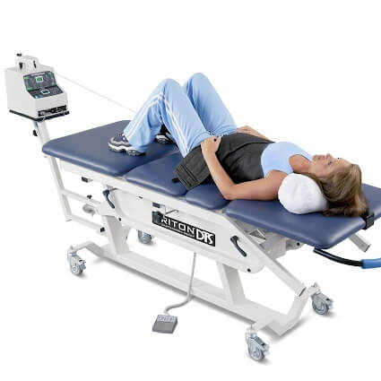 woman laying on spinal decompression table