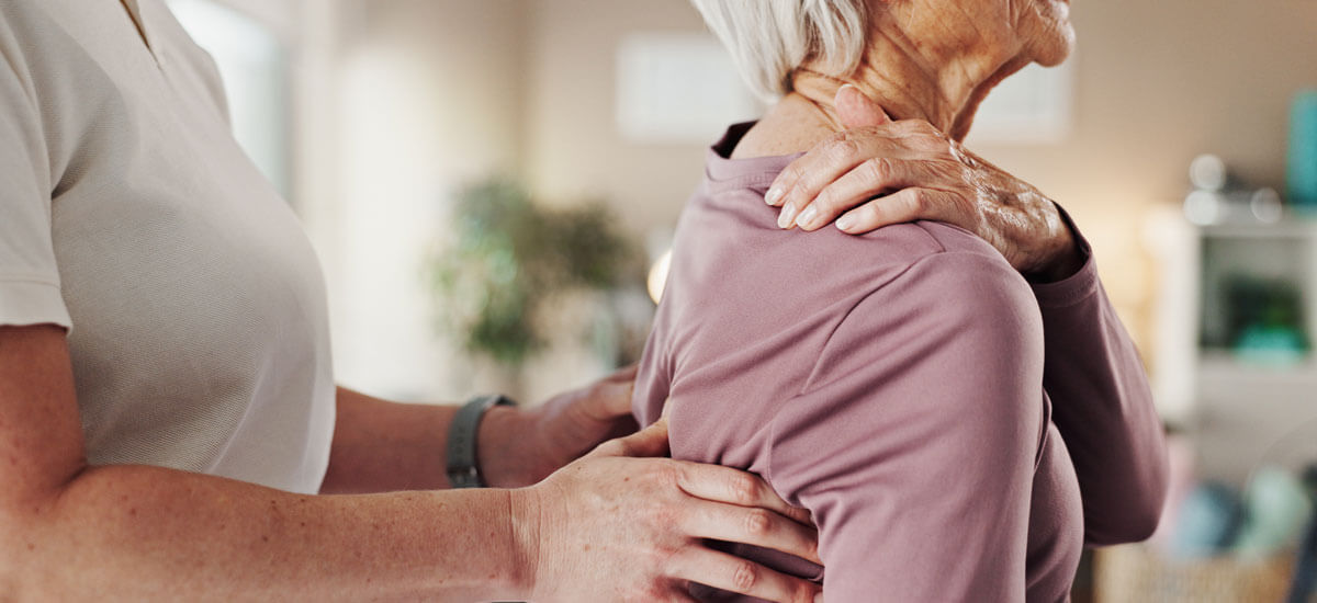 Woman holding neck and getting adjusted