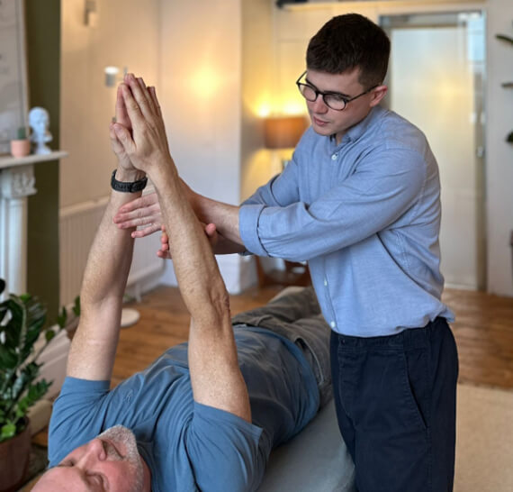 Bristol Chiropractor Max Bento working with patient
