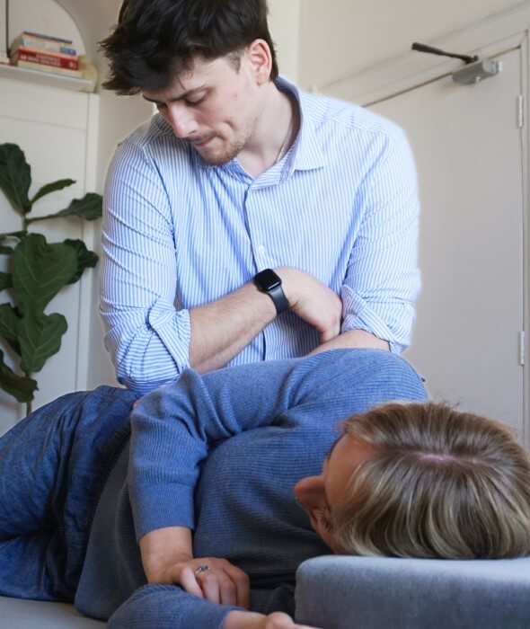 Chiropractor doing back adjustment