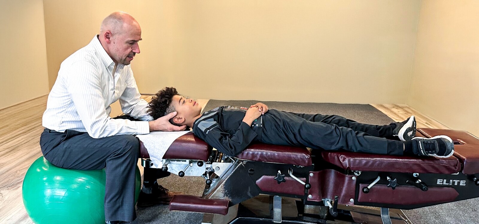 Stratham chiropractor Dr Rzepa adjusting childs neck