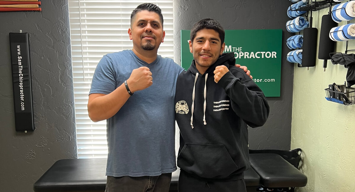 Dr. Sam posing with martial artist