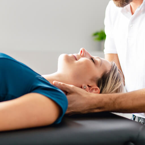Female patient's neck treated with a chiropractic adjustment