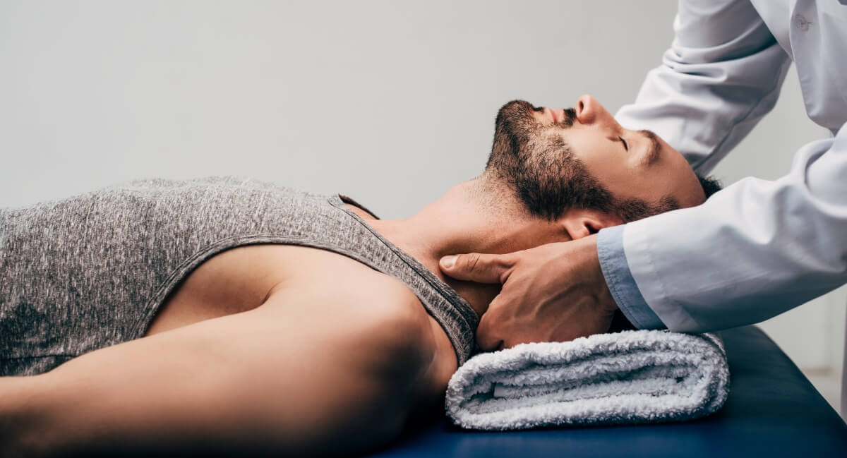 Chiropractor adjusting a patient's neck