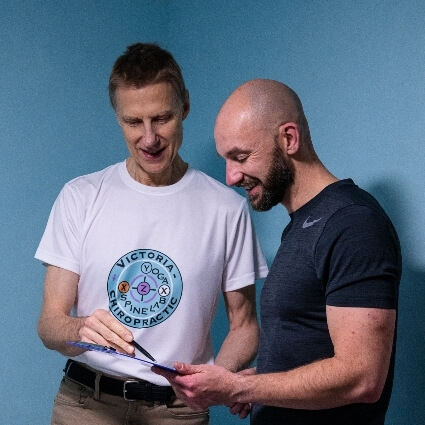 Pimlico chiropractor D Leom talking with patient