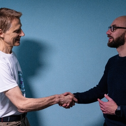 Dr Leom shaking patients hand