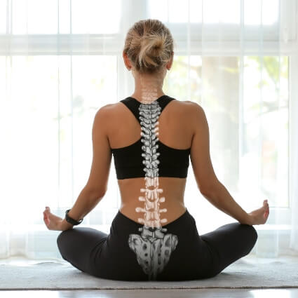woman doing yoga with spine illustration on her back