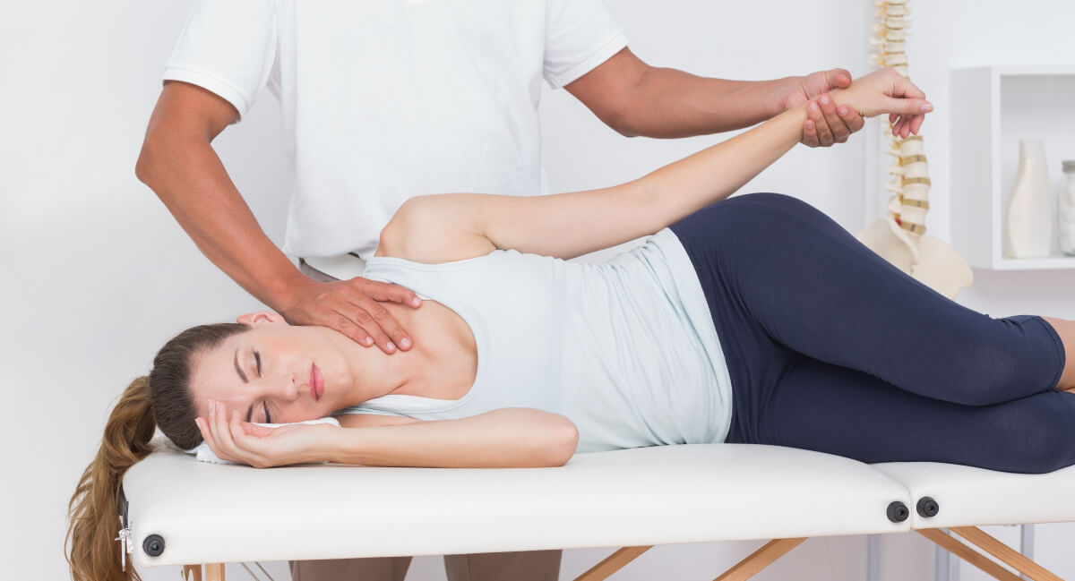 Female patient receiving a chiropractic adjustment