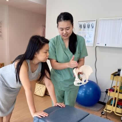 Dr Minji showing patient hip model